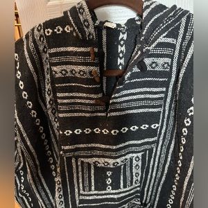Vintage drug rug, has wooden closures.
